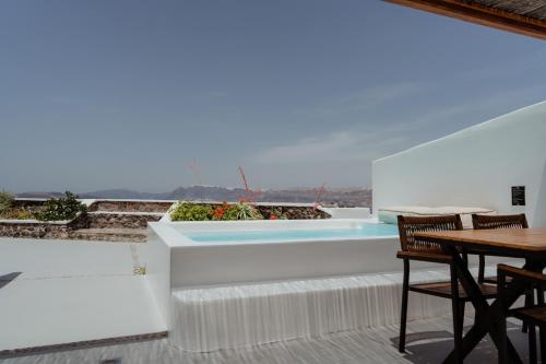 a view from the balcony of a villa with a swimming pool at Hotel Goulielmos in Akrotiri