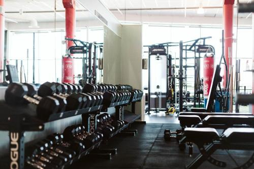 a gym with rows of dumbbells at Quality Hotel Sarpsborg in Sarpsborg