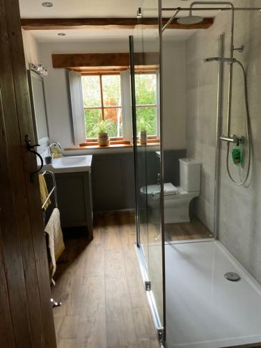a bathroom with a shower and a sink at Fox Hill in Brompton