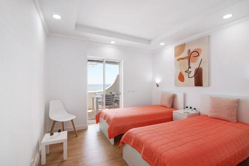 Postel nebo postele na pokoji v ubytování Moderno e renovado T2