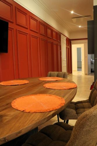 a conference room with a wooden table and chairs at Champagne André Bergère - Guest House in Épernay