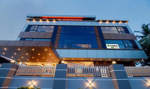 a view of the front of the hotel at Treebo Amigos Residency Cochin Airport Hotel in Cochin