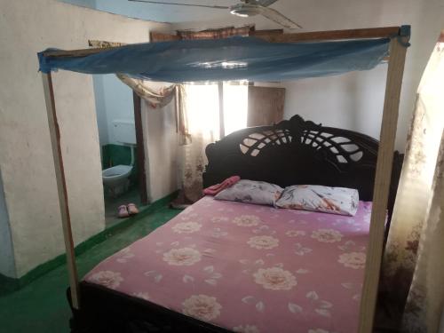 Ліжко або ліжка в номері Tabassam House