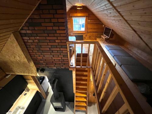 an overhead view of a staircase in a wooden cabin at Black Work Levi Autti in Kittilä