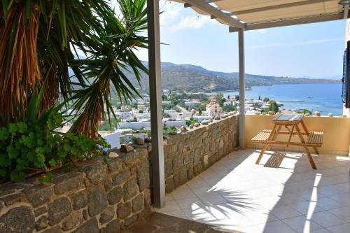 a patio with a view of the ocean from a house at Sea View Luxury Maisonette in Kapótidhes