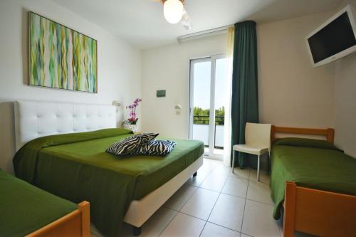 Postel nebo postele na pokoji v ubytování Hotel Matteo