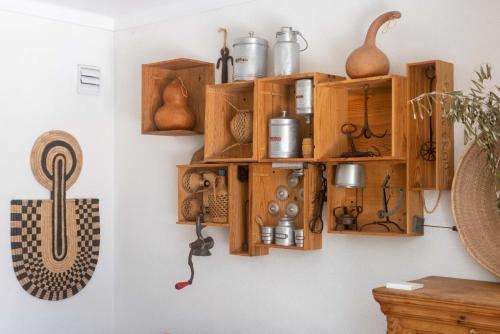 a room with wooden shelves on a wall at The 98 Place Carcavelos in Carcavelos