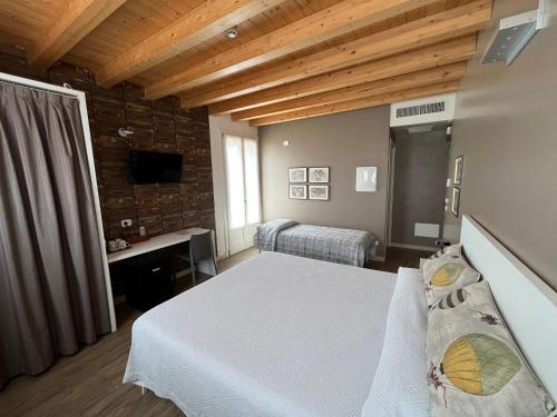 Postel nebo postele na pokoji v ubytování Agriturismo Corte Ambrosio