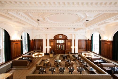 a large dining room with tables and chairs at Aloft Liverpool in Liverpool