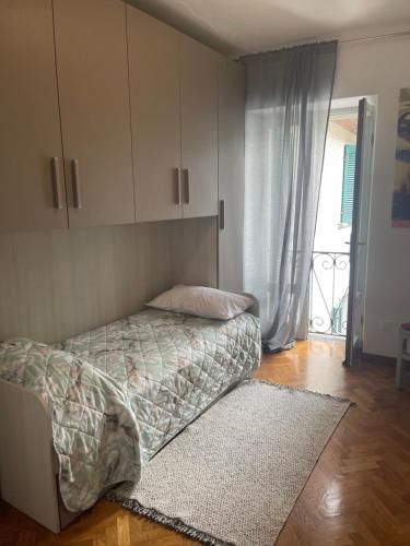 Postel nebo postele na pokoji v ubytování L'Isola dei Sapori