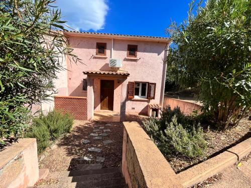 a house with a pathway leading to the front of it at residence Catalani in Zonza