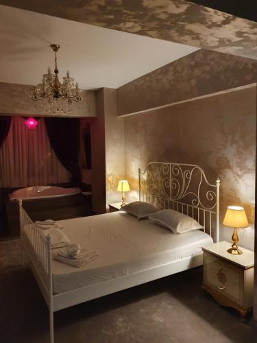 Кровать или кровати в номере Studio Rendez-vous Alba Iulia