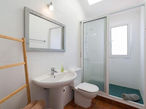 a bathroom with a sink and a toilet and a shower at Casa Velero to 100mt from beach , optical fiber in La Oliva