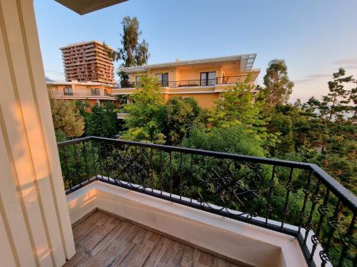 a balcony with a view of a building at Dreamland Oasis in Chakvi in Chakvi