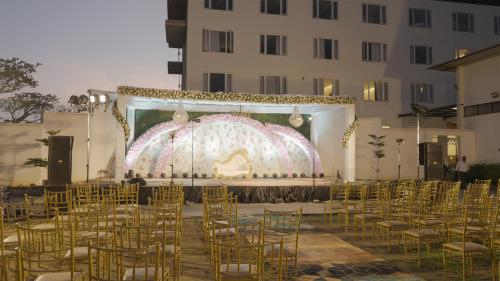 a group of chairs in front of a stage at Mayur Belgaum Presidency Hotel & Spa in Belgaum
