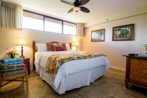a bedroom with a bed and a ceiling fan at Kaanapali Shores 448 in Kaanapali