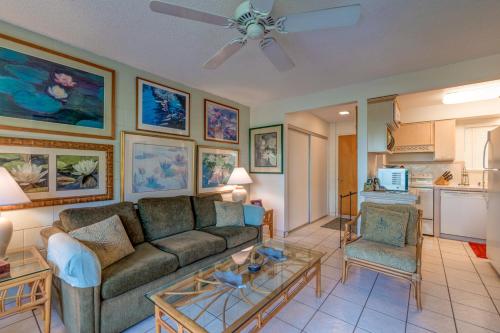 a living room with a couch and a table at Hono Kai A3 in Maalaea