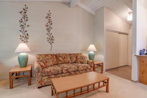a living room with a couch and two tables at Hono Kai C12 in Maalaea