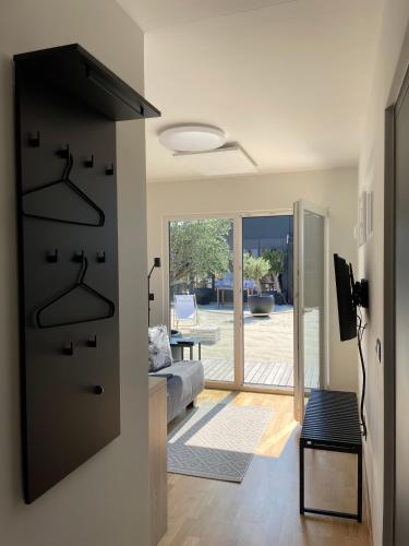 a room with a door leading to a living room at Skyfall Rooms in Eisenstadt