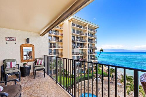 an apartment balcony with a view of the ocean at Hololani A402 in Kahana
