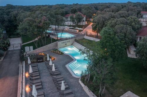 an overhead view of a swimming pool in a yard at Luxury Glamping Beach Villas Porto Bus in Bale
