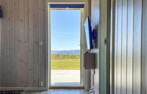 an open door with a view of a field at Nice Home In Gol With Kitchen in Golsfjellet