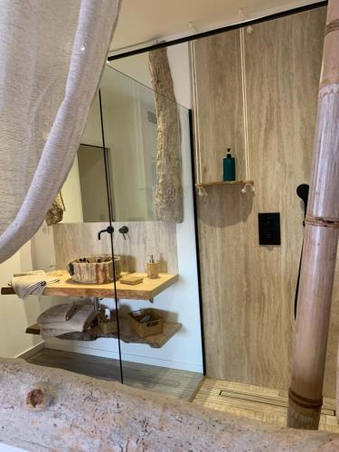 a bathroom with a sink and a mirror at VILLA MACAGNA in Corbara