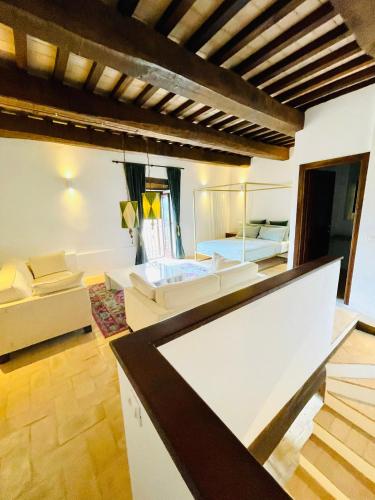 a living room with two beds and a couch at Casa Fossatello in Nocera Umbra