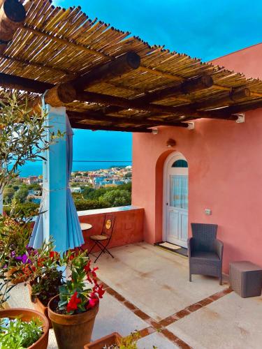 a patio with a view of a house at sole chiaro home in Procida