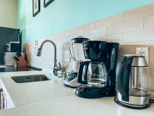 a kitchen counter with a coffee maker on it at El Sitio Village in Playa Venao
