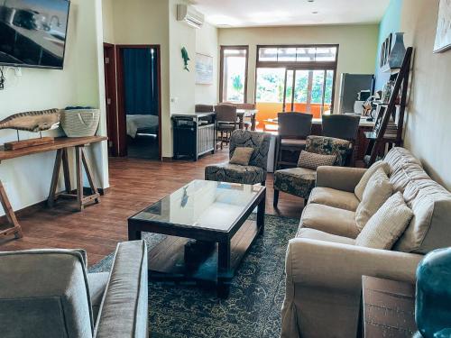 a living room with couches and a coffee table at El Sitio Village in Playa Venao