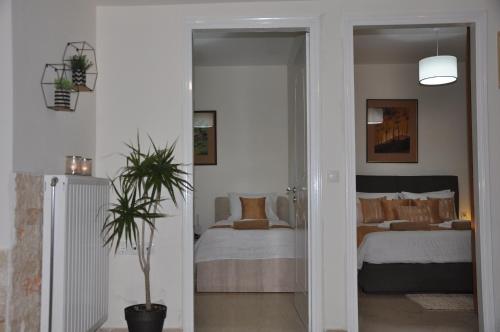 Ένα ή περισσότερα κρεβάτια σε δωμάτιο στο Manos House Hersonisos