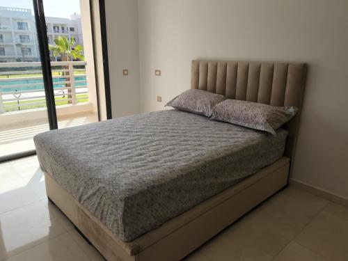 Postel nebo postele na pokoji v ubytování Appartement Costa Beach Bouznika