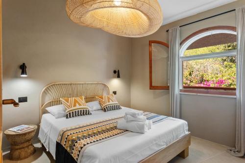 Кровать или кровати в номере Baia Dorata beach apartments