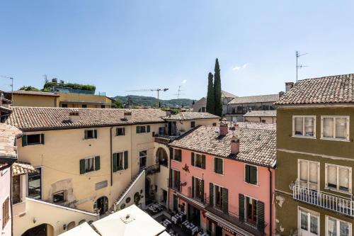 an aerial view of a city with buildings at Appartamenti BETTELONI in Bardolino