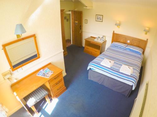an overhead view of a bedroom with a bed and a desk at The Red Lion in Lowick Green
