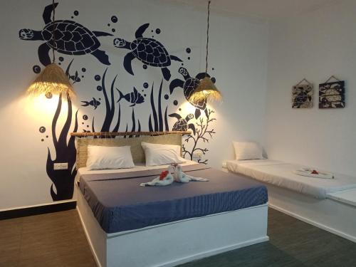 Ένα ή περισσότερα κρεβάτια σε δωμάτιο στο Ocean Breeze Boutique Hotel