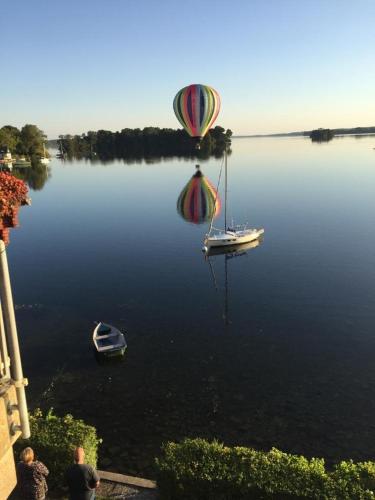 a hot air balloon floating in a body of water at FEWO-Ammermann in Plön