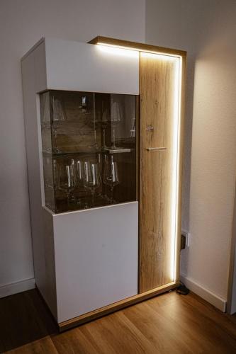 a refrigerator with a glass door in a room at Ferienwohnung Bergzeit in Oy-Mittelberg