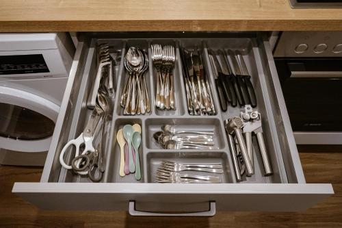 a drawer filled with utensils in a kitchen at Ferienwohnung Bergzeit in Oy-Mittelberg