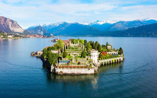 an island in the middle of a body of water at La Casa dei Laghi 1 Comabbio Monate Maggiore Orta in Mercallo