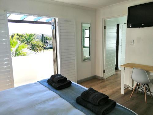 Katil atau katil-katil dalam bilik di Malmesbury Self-catering