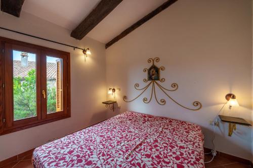 Un pat sau paturi într-o cameră la Lu Stazzu di Tarraolta 4
