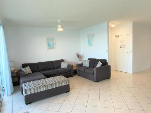 a living room with two couches and a couch at Quayside in Nambucca Heads