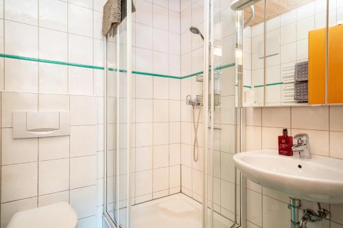 a bathroom with a shower and a sink at Apartment Wesseling in Fontanella
