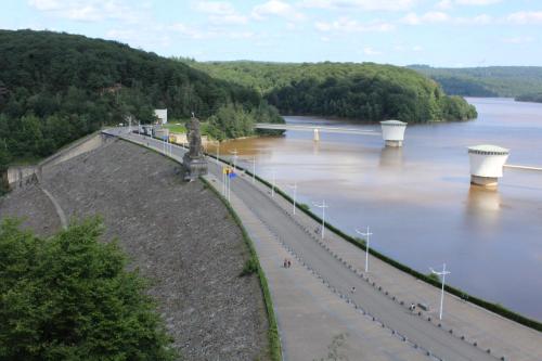 a view of a river with a bridge at L'Écureuil - Terrasses de Malmedy in Malmedy