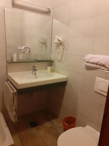 a bathroom with a sink and a toilet at Kupreski san1 in Kupres