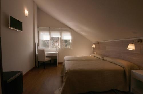 Hotel Don Pepe Riaにあるベッド