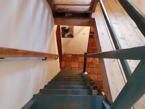 a staircase in a building with a stair case at Historisches Refugium in der Altstadt von Ebersberg in Ebersberg