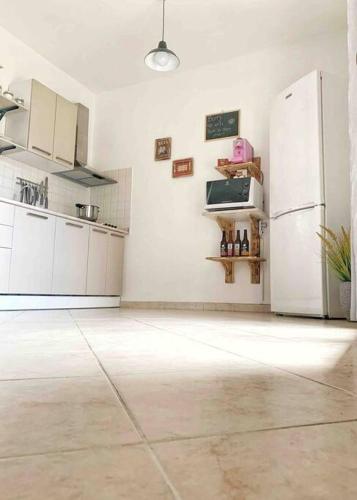 Η κουζίνα ή μικρή κουζίνα στο DomoMea Apartment